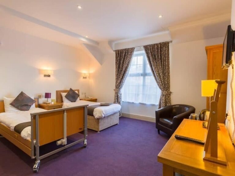 Bedroom with a profiling bed and wheelchair friendly layout