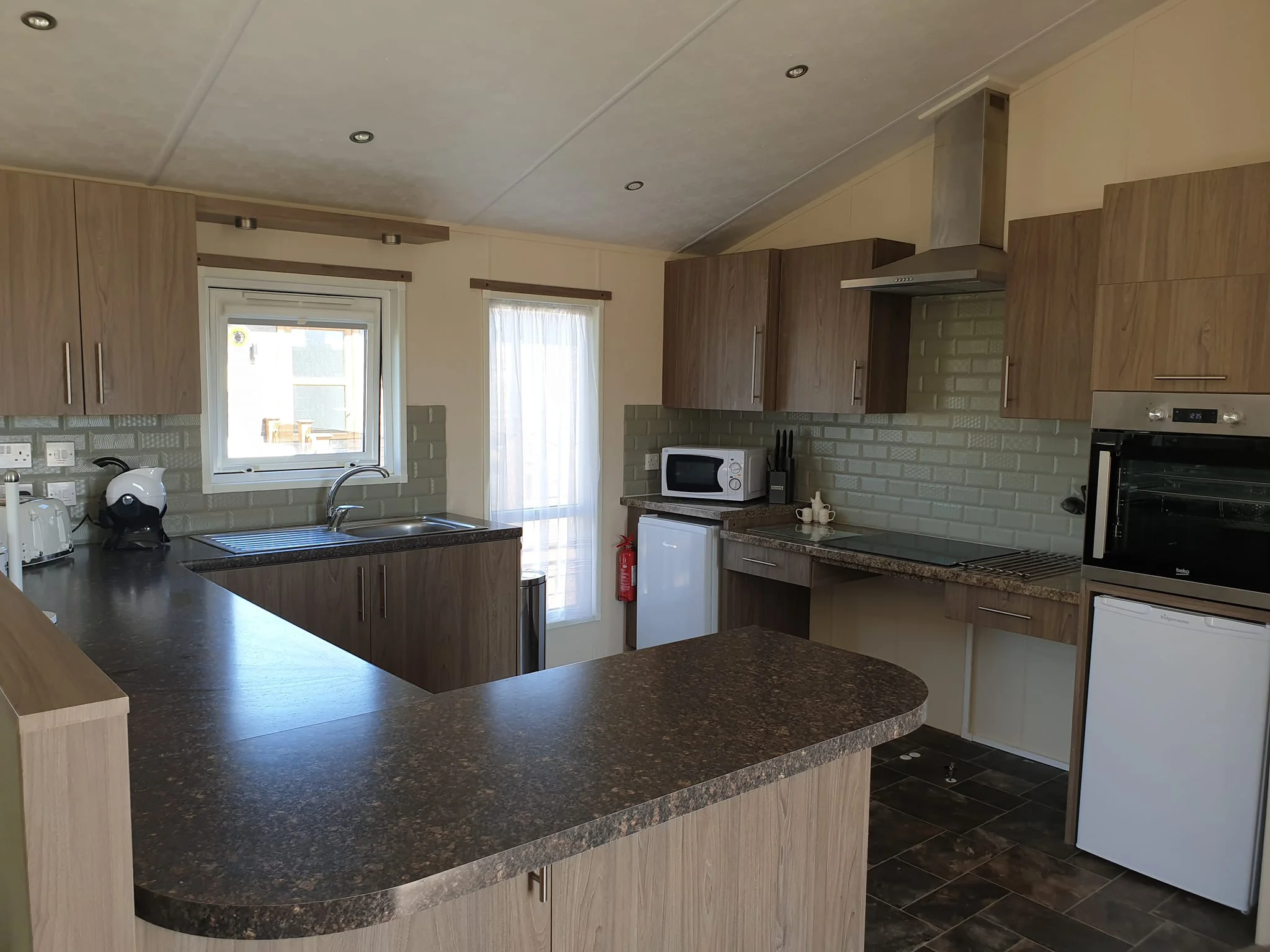 Accessible kitchen with wheel under kitchen counters