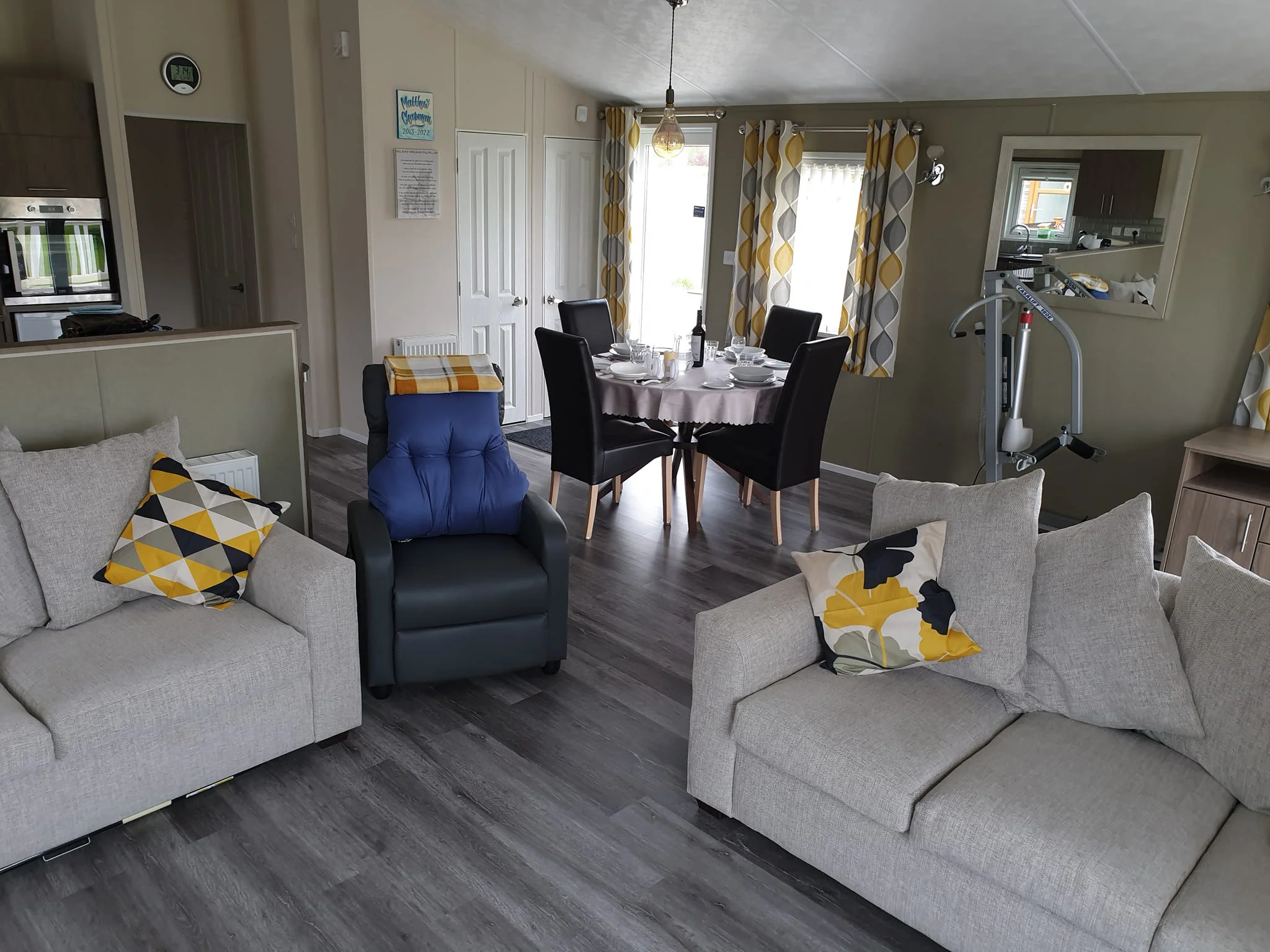 Living room with riser recliner chair and mobile hoist