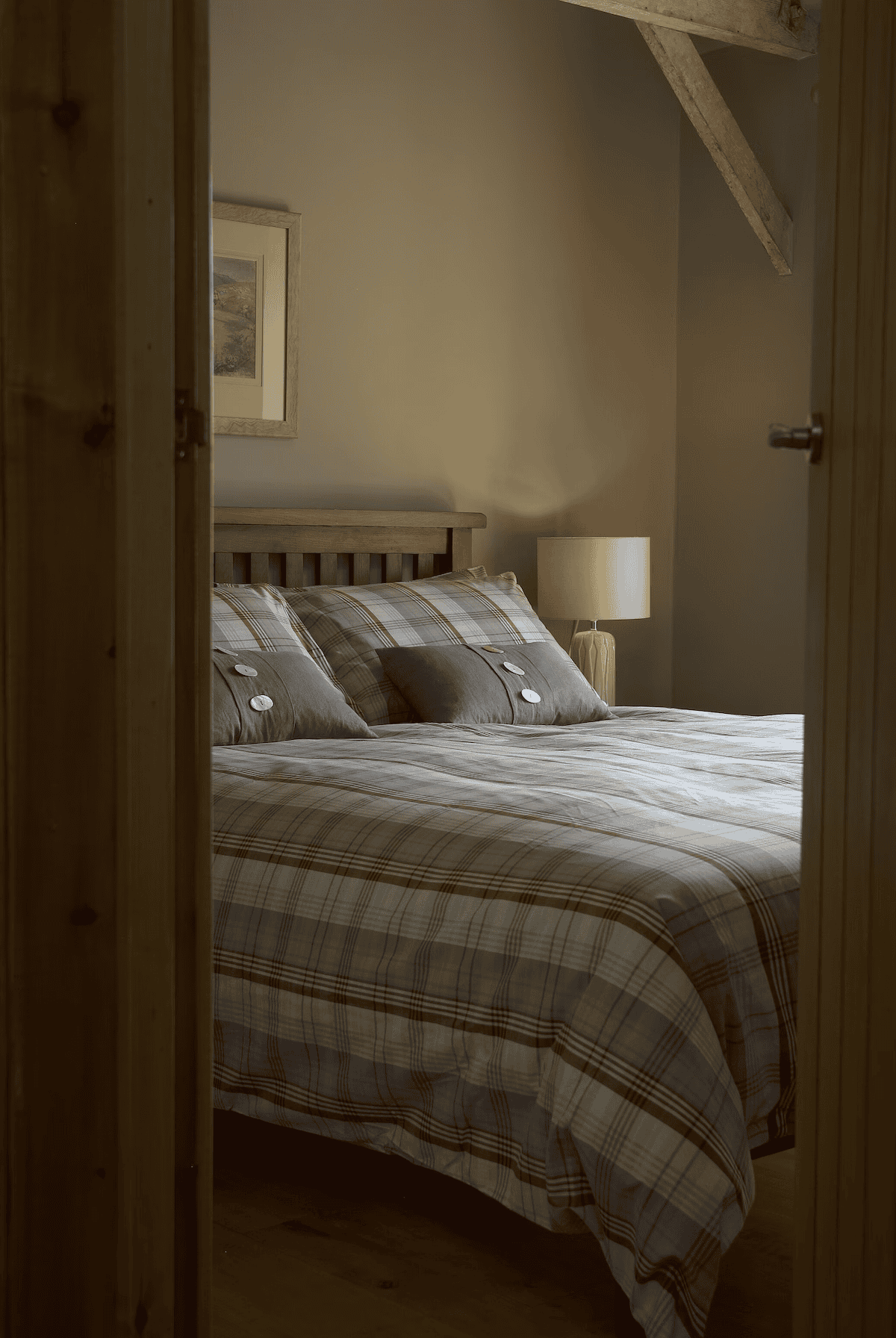 Cozy rustic bedroom with plaid bedding