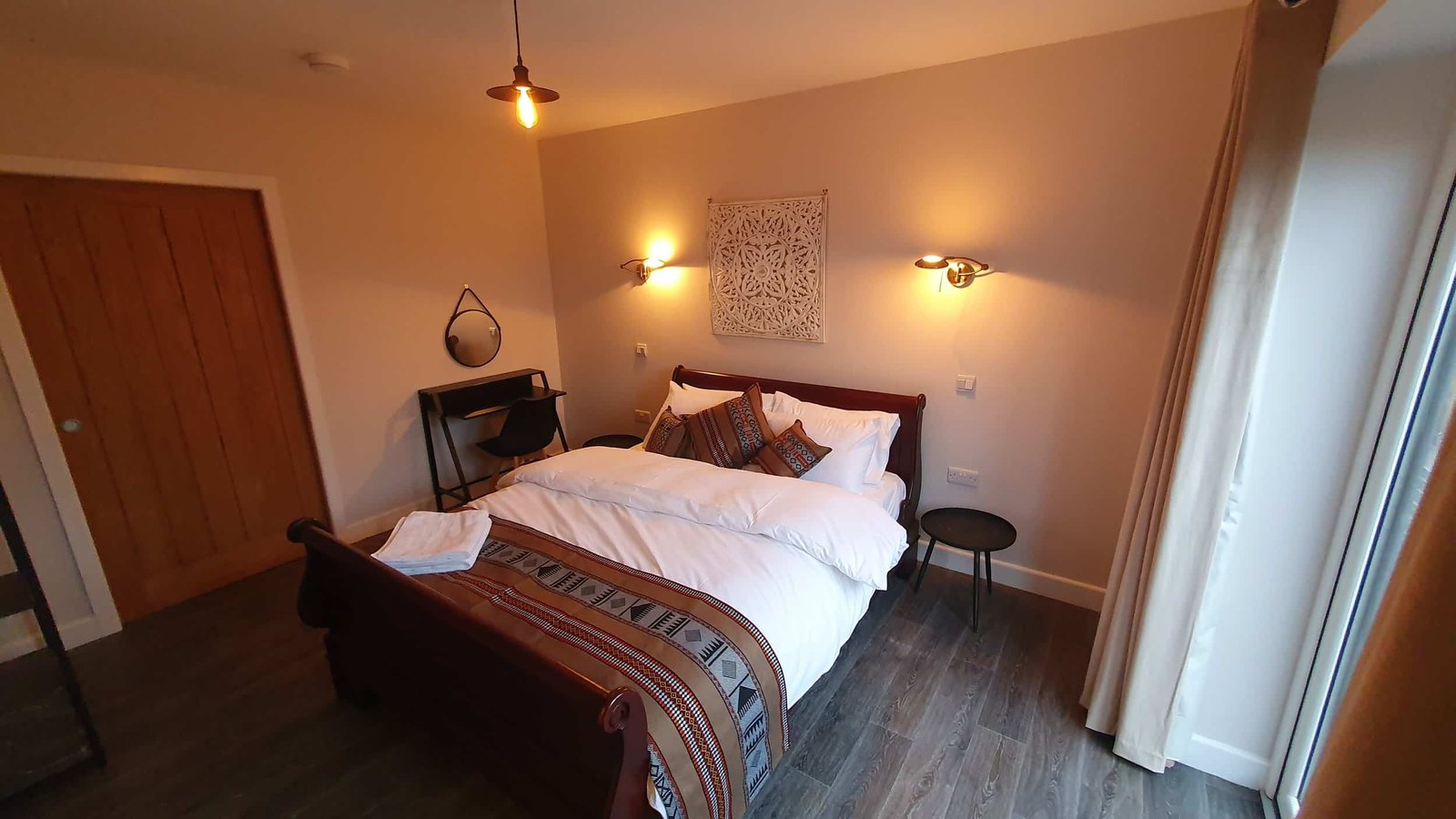 Cozy bedroom with stylish decor and wooden accents
