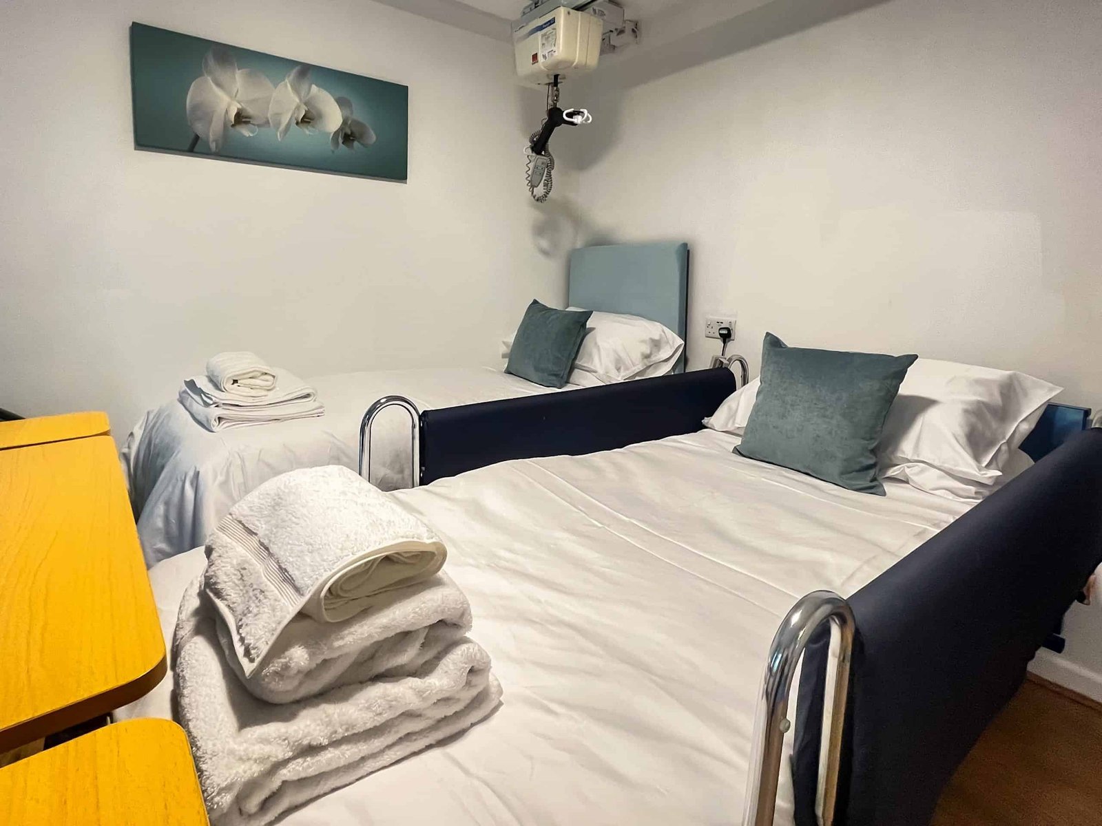Cozy hospital room with twin beds and soft lighting