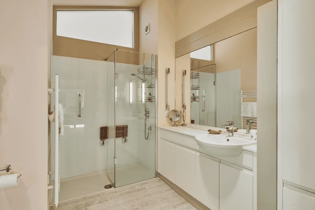 Modern bathroom with glass shower and white vanity