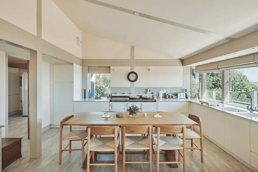 Spacious modern kitchen with dining area and large windows