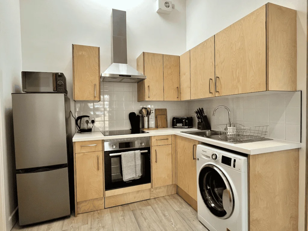 Modern kitchen with wooden cabinets and built-in appliances