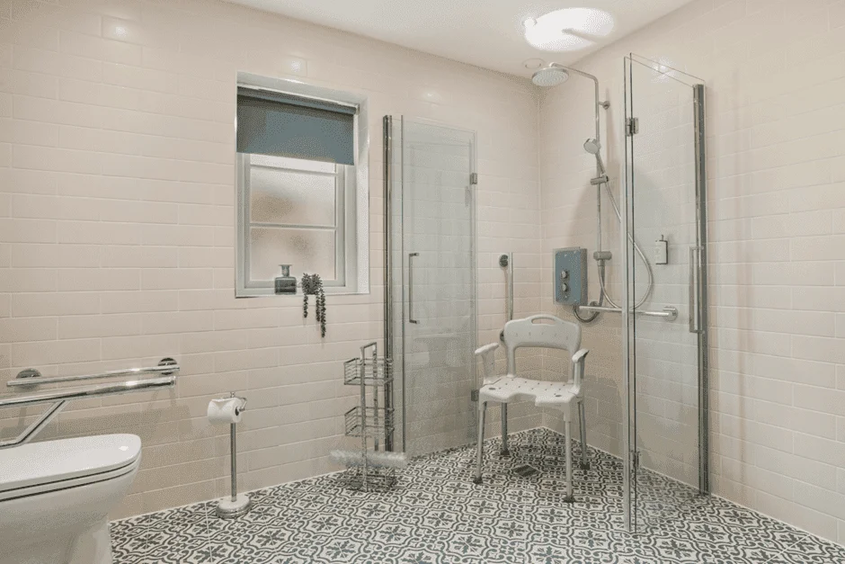 Accessible bathroom with shower seat and grab bars