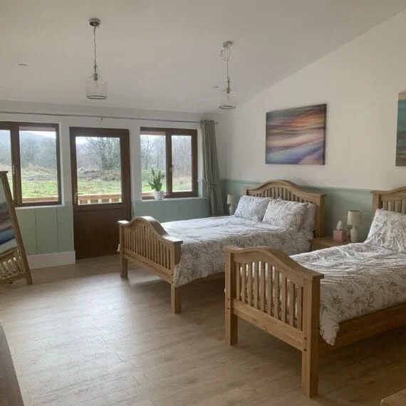 Cozy bedroom with two beds and scenic window view