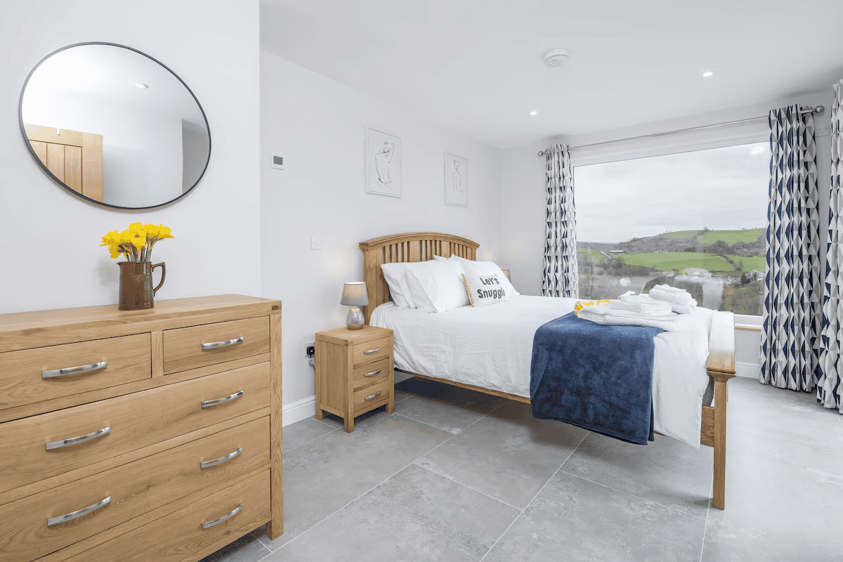 Cozy bedroom with scenic countryside view