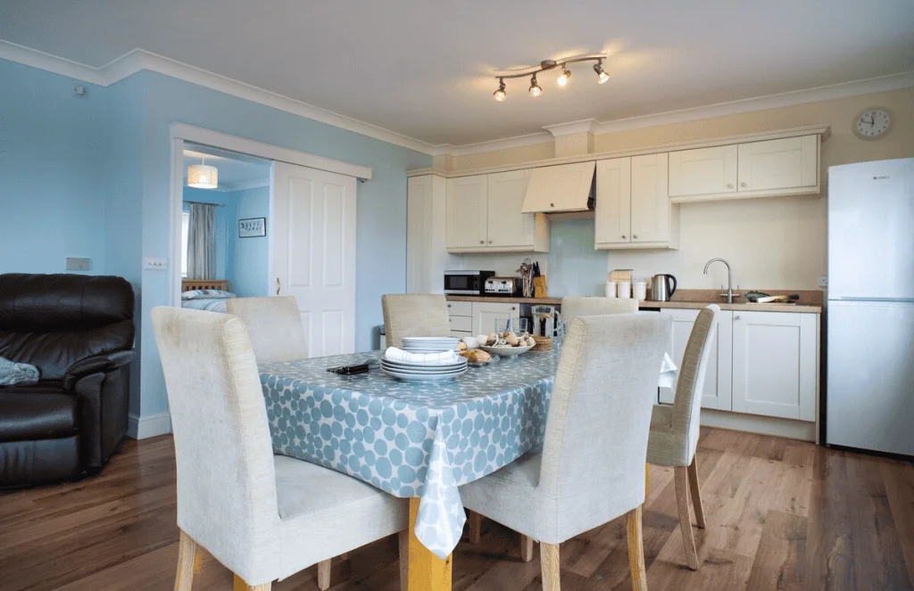 Modern kitchen and dining room interior with blue decor