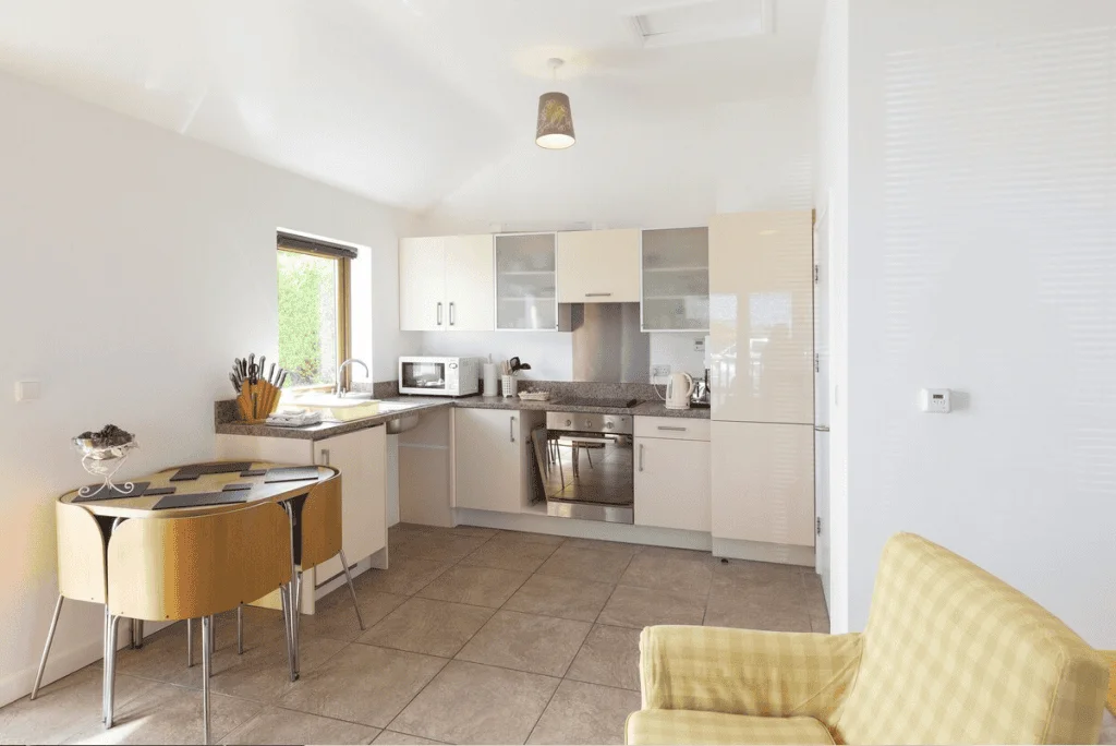 Modern kitchen interior with bright lighting and furniture