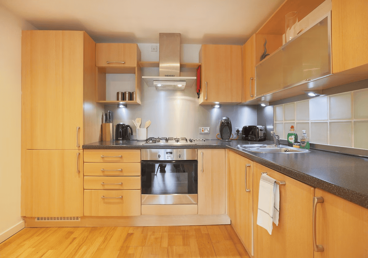 Modern kitchen interior with wooden cabinets and appliances