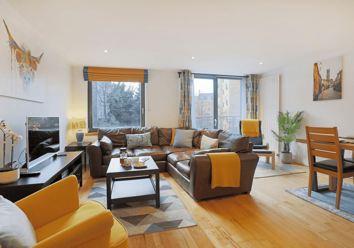 Bright modern living room with large sectional sofa