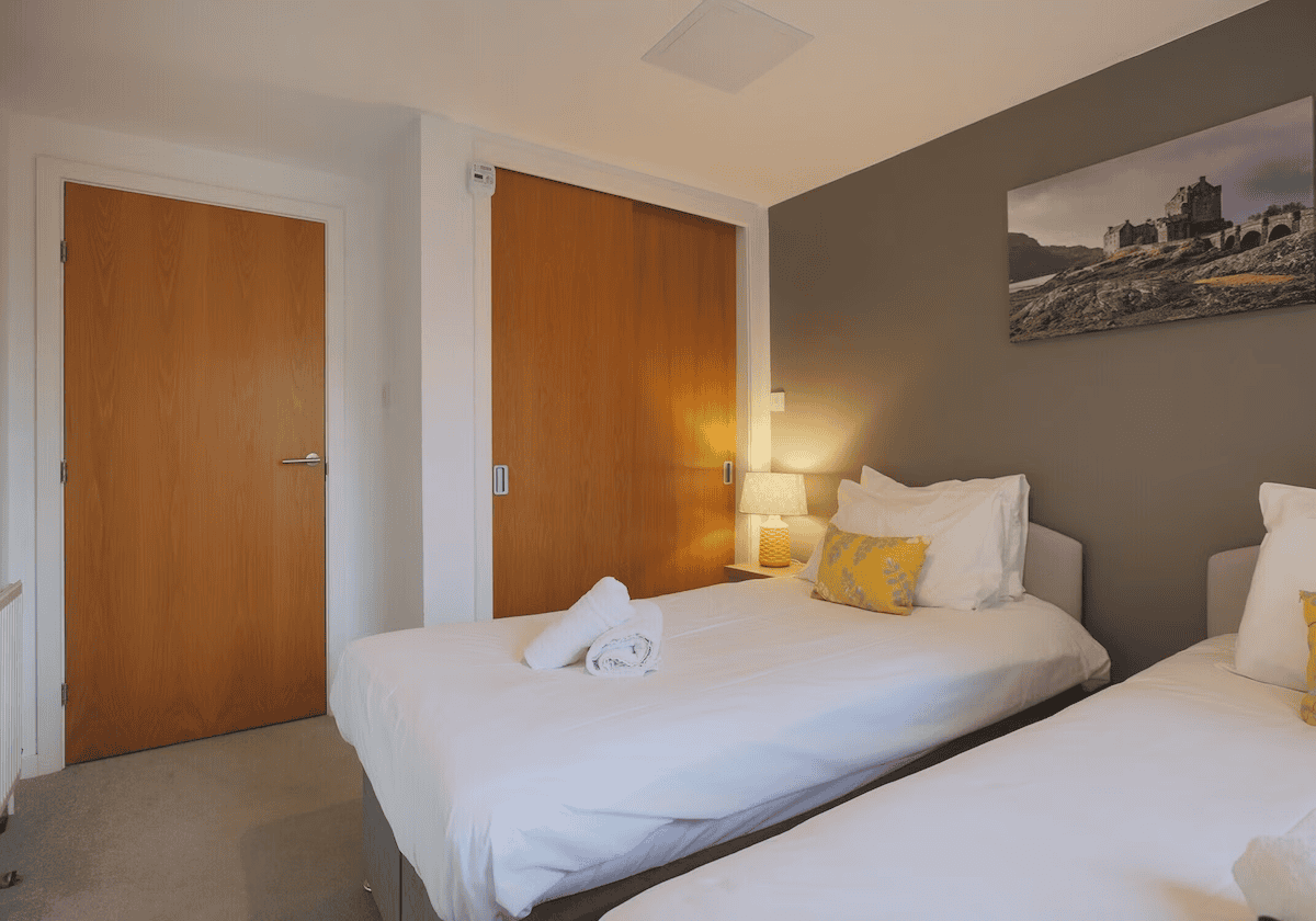 Modern bedroom with wooden doors and castle wall art