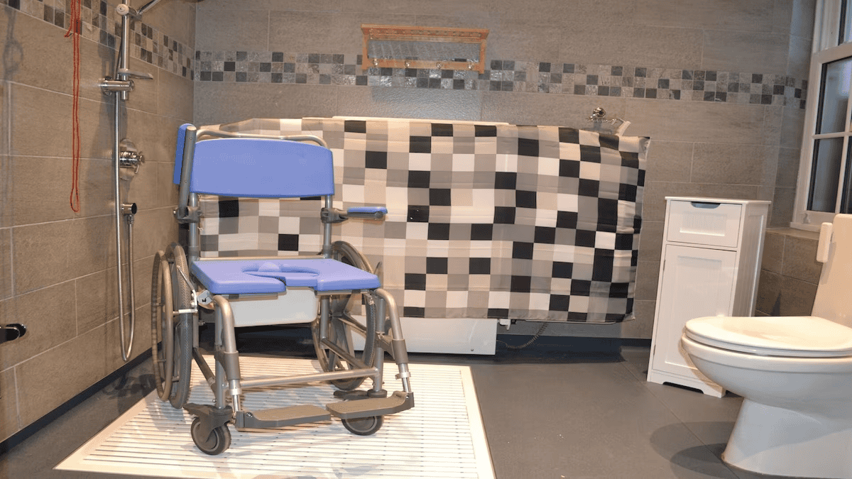 Accessible bathroom with wheelchair and shower facilities