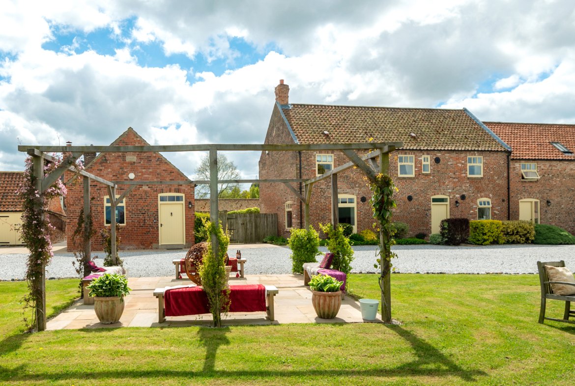 Charming countryside brick house with garden view.