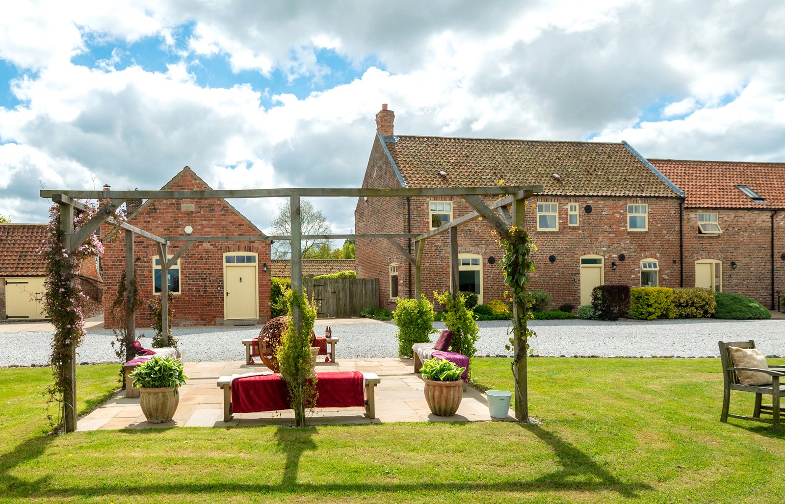 Charming countryside brick house with garden view.