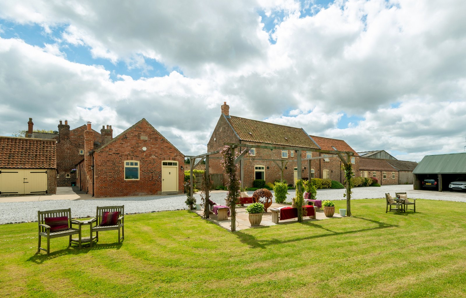 Charming countryside farm buildings under cloudy sky