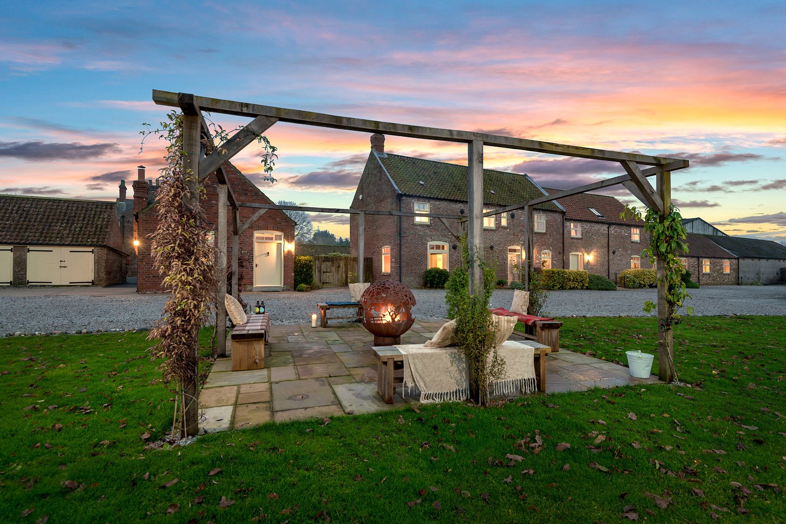 Charming countryside home at sunset, patio and fire pit.