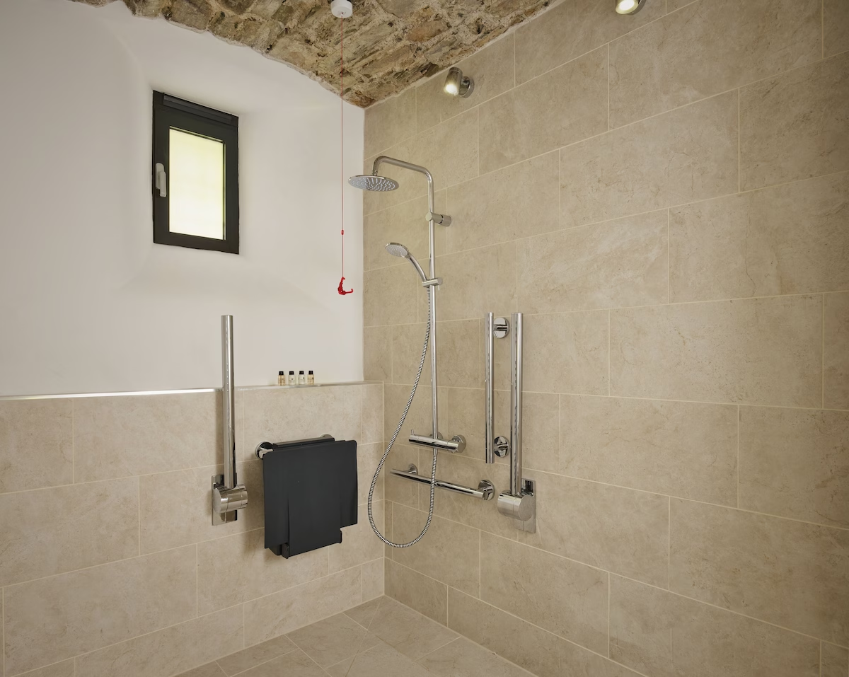 Accessible bathroom with modern shower facilities.