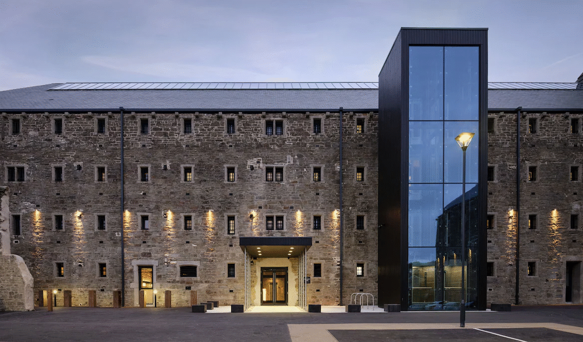 Historic brick building with modern glass extension.