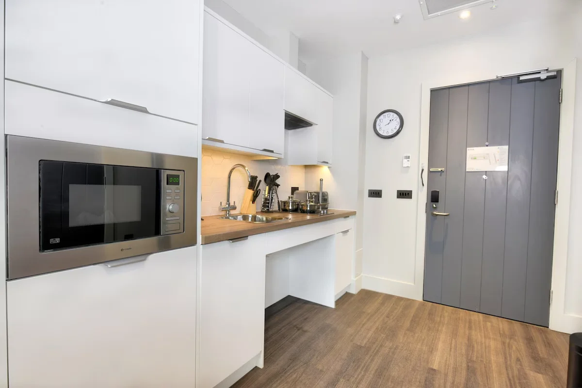 Accessible holiday let kitchen with clear space and reachable appliances